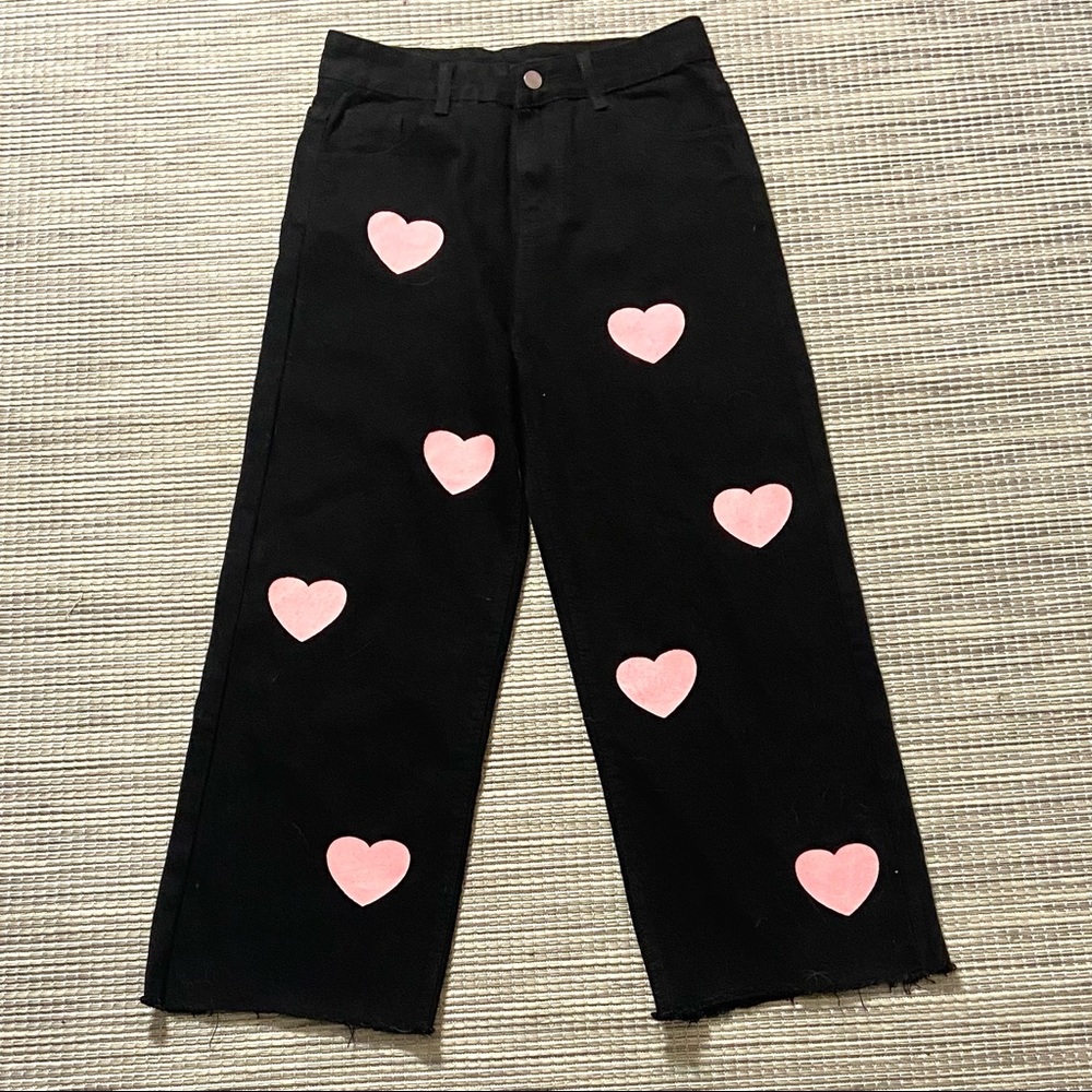 black jeans with pink hearts